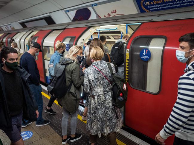 Commuters wearing face masks due to the COVID-19 pandemic in London. The UK has reported a marked jump in the daily infection rate a day after Prime Minister Boris Johnson unveiled new nationwide restrictions. Picture: AFP