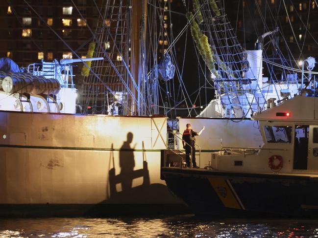 A New York Police Department harbour unit prepares to board the vessel. Picture: AP
