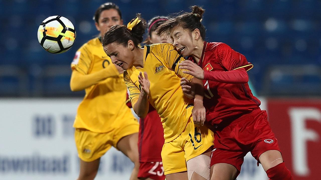 Hayley Raso of Australia and Tran Thi Hong Nhung of Vietnam battle for the ball during the AFC Women's Asian Cup Group B match.