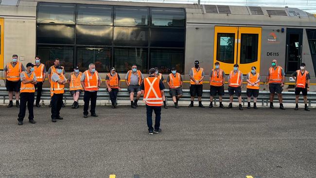 Train workers on strike in Mortdale on Monday.