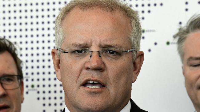 Prime Minister Scott Morrison (centre) speaks to the media during the official opening of the Western Sydney International Experience Centre, Luddenham, NSW, Monday, September 2, 2019. ( AAP Image/Bianca De Marchi) NO ARCHIVING