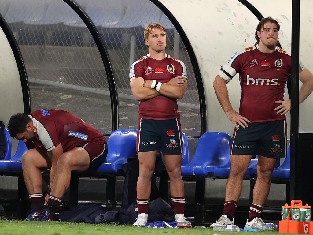 Reds pair Tate McDermott (centre) and Fraser McReight (right) have been suspended for three matches. Picture: Fiona Goodall/Getty Images