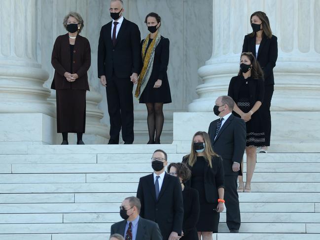 People watch as the casket of Associate Justice Ruth Bader Ginsburg arrives at the US Supreme Court where she will lie in repose. Picture: AFP