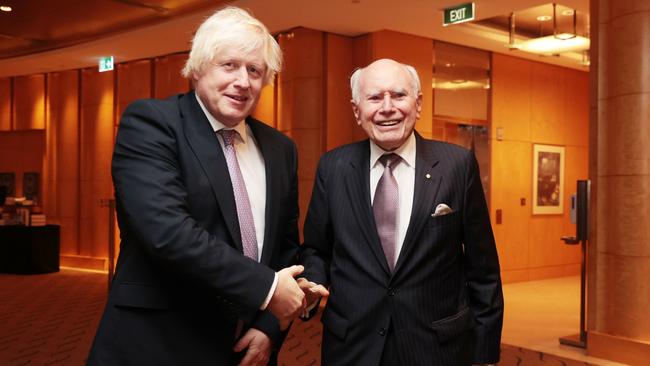 Former British prime minister Boris Johnson with John Howard at the Fullerton Hotel in Sydney on Wednesday night. Picture: Jane Dempster