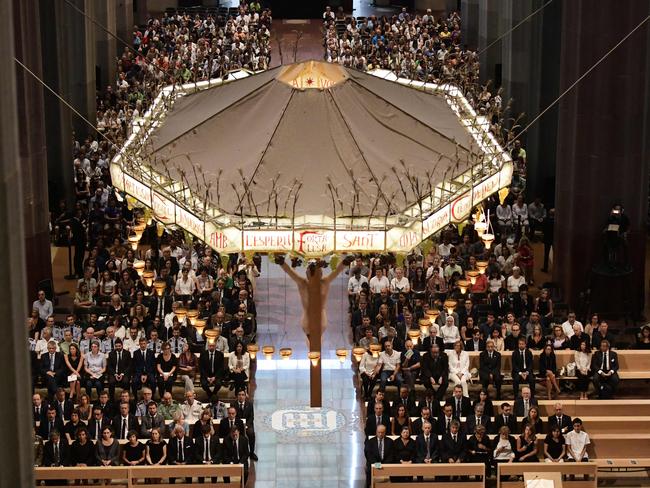 People attend a mass to commemorate victims of two devastating terror attacks in Barcelona and Cambrils, at the Sagrada Familia church in Barcelona. Picture: AFP/Javier Soriano