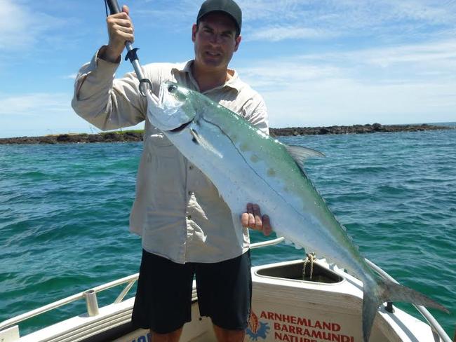 Justin Clinch with a queenfish caught where the current hits a rocky point.