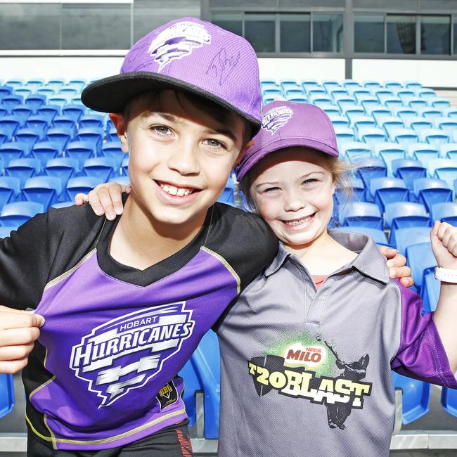 Angus, 9, with sister Phoebe Twining, 5, of Kingston at the Hobart Hurricanes open training session at Blundstone Arena. Picture: ZAK SIMMONDS