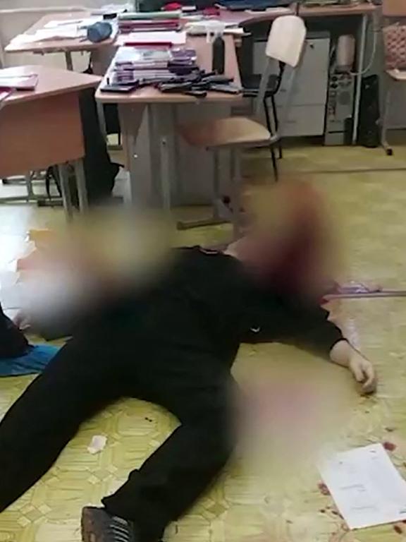 Footage released by the Investigative Committee of Russia shows the body of a gunman in school No88 in Izhevsk. Picture: AFP