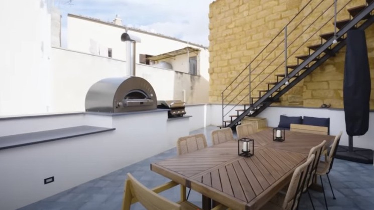 There’s a pizza oven and plenty of space to entertain on the roof. Picture: CNBC Make It/YouTube