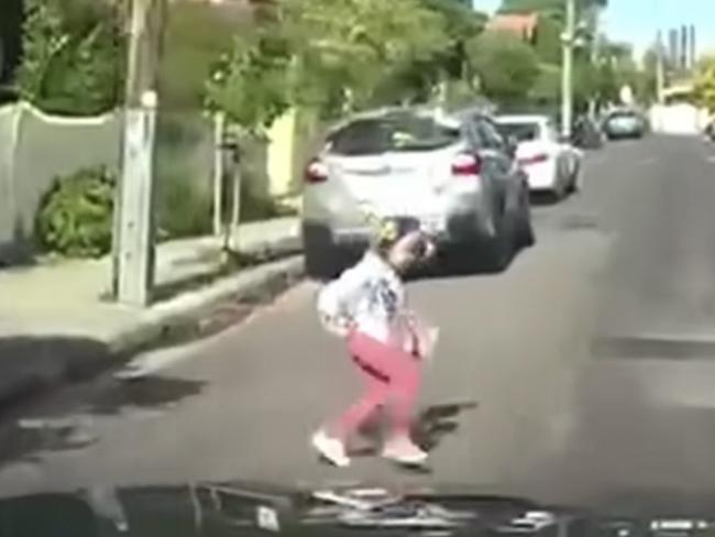 Footage posted to the Dash Cam Australia Facebook page shows a girl hit by a car in a Melbourne suburb.