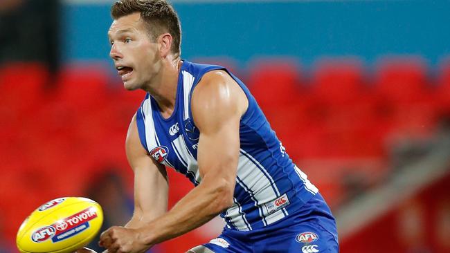 The Cats are all over North Melbourne veteran Shaun Higgins. Picture: AFL Photos/Getty Images