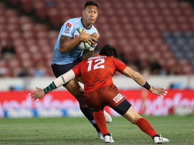 Israel Folau of the Waratahs is tackled by Harumichi Tatekawa of the Sunwolves during the Super Rugby match played in Newcastle last week. Picture: Paul Barkley