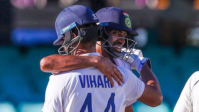 India's Ravichandran Ashwin embraces teammate Hanuma Vihari after a famous draw at the Sydney Cricket Ground.