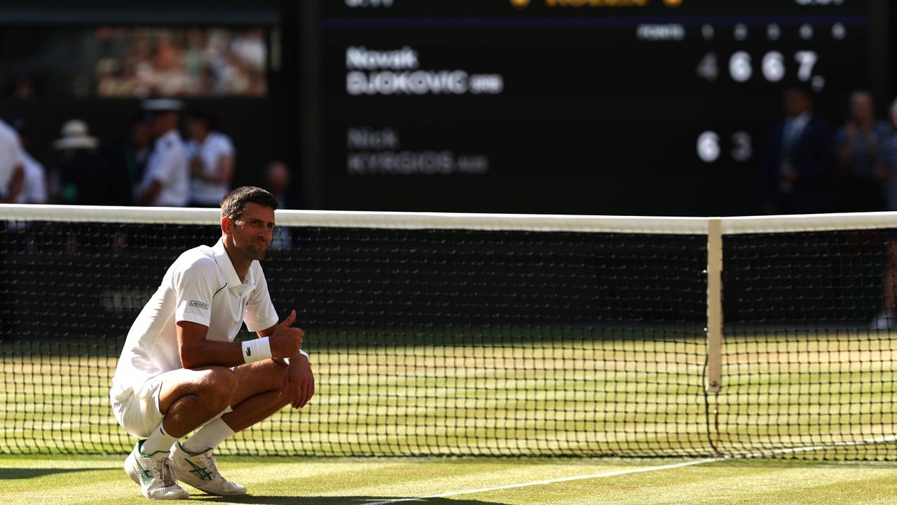 Novak Djokovic of Serbia celebrates winning match point against Nick Kyrgios