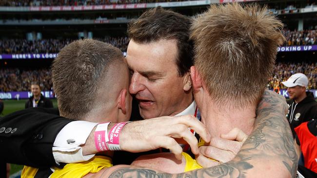 Tiger stars Dustin Martin and Jack Riewoldt hug CEO Brendon Gale after the Grand Final. Picture: Getty Images