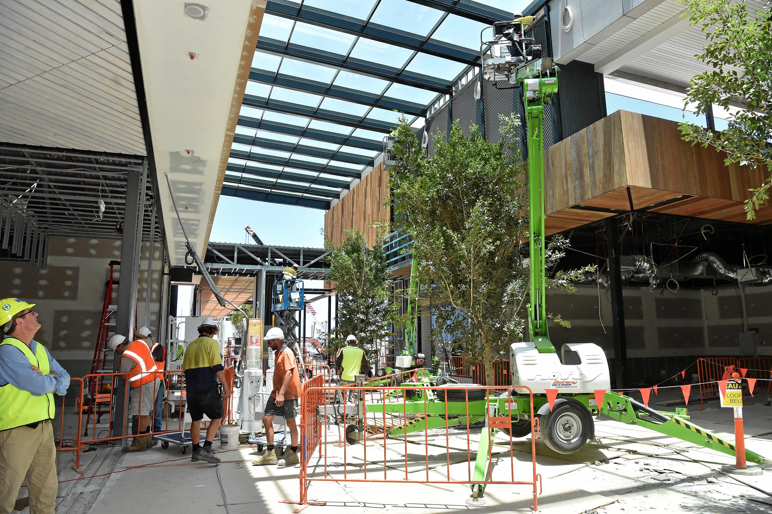 Full steam ahead for the opening of the Stockland Birtinya Shopping Centre. Constuction workers put the final pieces together for the grand opening in a couple of weeks. Picture: Warren Lynam