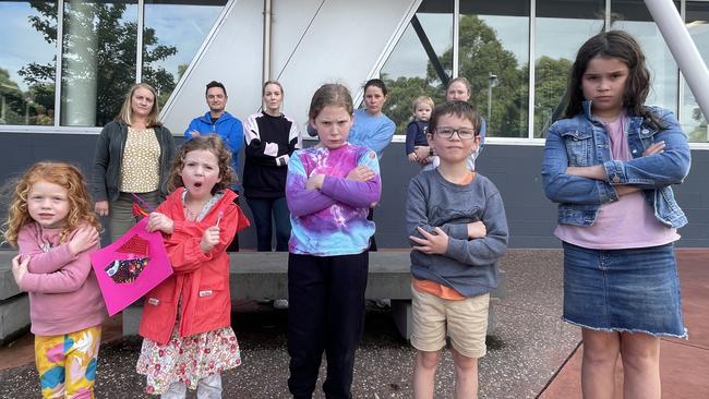 Past and present users of Aquanation’s childcare – Caitlin, 3, Cailin, 5, Nayla, 8, Adam, 6, and Charlotte, 8, and their parents are upset with Maroondah Council’s decision to axe the service on June 30. Picture: Kiel Egging.