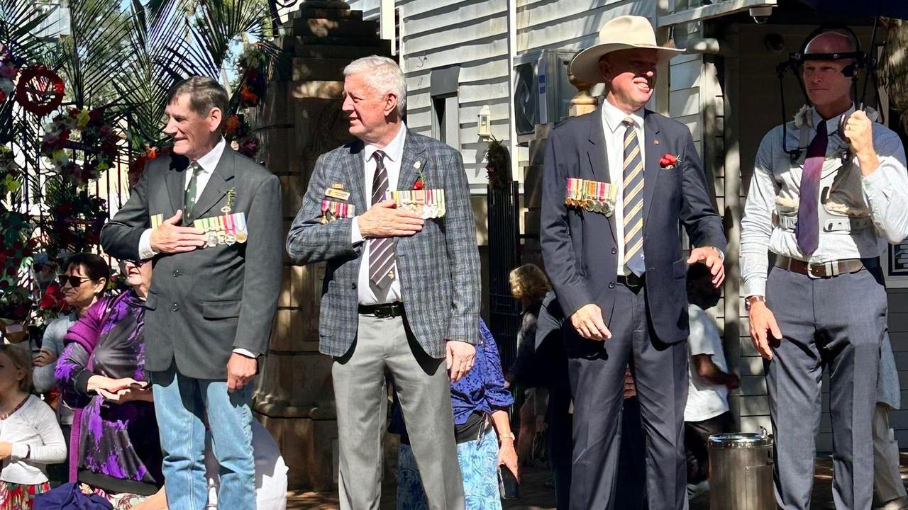 Gympie MP Tony Perrett and Mayor Glen Hartwig watch the parade.