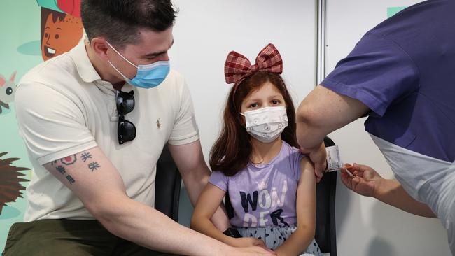 Alexa, 6, gets her Covid-19 vaccination at Sunshine Hospital as dad Pat Harding offers support. Picture: David Caird