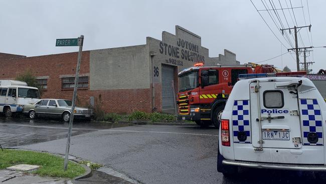 Emergency services on the scene of a factory fire in Reservoir. Picture: Kirra Grimes