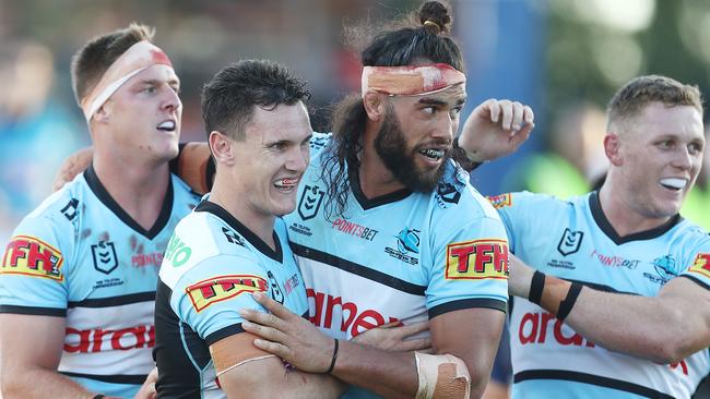 SYDNEY, AUSTRALIA - APRIL 03: Connor Tracey of the Sharks celebrates scoring a try with team mates during the round four NRL match between the Cronulla Sharks and the North Queensland Cowboys at Netstrata Jubilee Stadium, on April 03, 2021, in Sydney, Australia. (Photo by Mark Metcalfe/Getty Images)