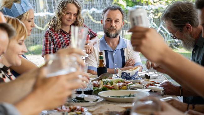 Supplied exclusive first look at BINGE film, How To Make Gravy, based on the Paul Kelly song.. At the end of the table is Angus played by Jonah Wren Phillips and Joe played by Daniel Henshall. Picture: BINGE / Jasin Boland