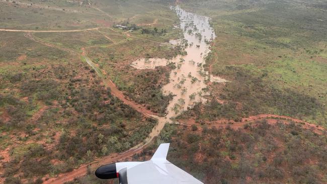 Cops and emergency service workers search for those stranded in the flooded Tanami Desert. Picture: NT Police