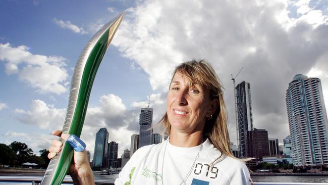 Glynis Nunn with the Gold Coast Commonwealth Games baton. Picture: Steve Pohlner.