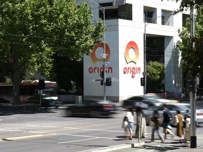 Pedestrians in front of the Origin Energy Ltd. office in Melbourne, Australia, on Wednesday, Nov. 15, 2023. Origin Energy’s biggest shareholder AustralianSuper lifted its stake in the takeover target a week before the deciding shareholder vote on the Brookfield Asset Management-led bid. Photographer: Carla Gottgens/Bloomberg