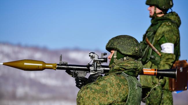 A marine aims an RPG-7, a portable rocket-propelled grenade launcher, during military exercises conducted by the Russian Pacific Fleet's naval infantry unit at the Bamburovo firing range last February. Picture: Yuri Smityuk/TASS/Getty Images