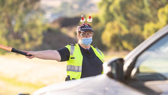 Police on the NSW/Victorian border checking motorists for border passes. Picture: Simon Dallinger