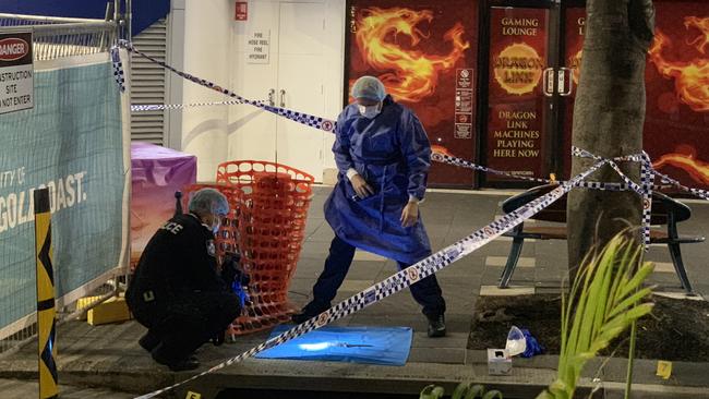 Police investigators at the scene in Surfers Paradise.