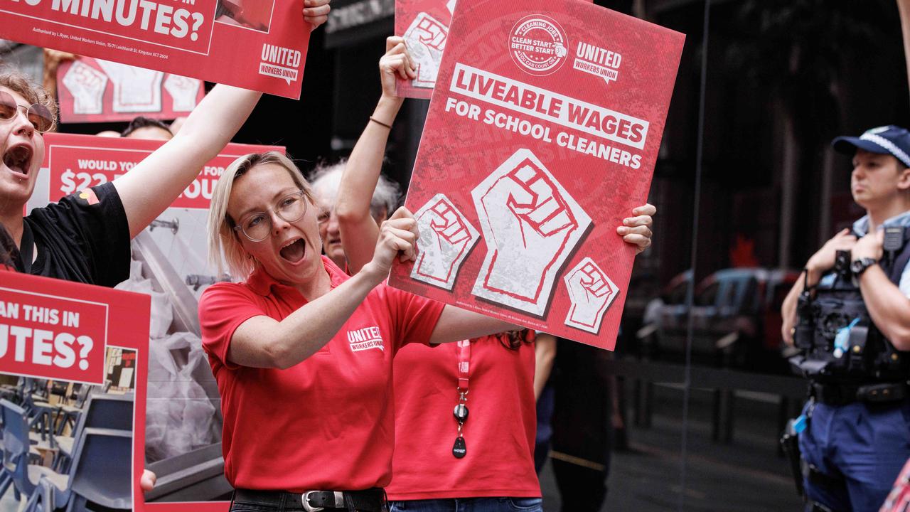 Protesters held a combination of slogan signs and images of the gross things they are forced to confront at work. Picture: NCA NewsWire / David Swift