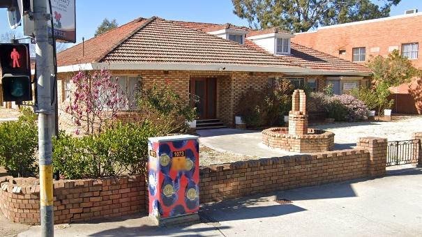 The old John Price &amp; Son funeral home on the corner of Henry and Station Streets, Penrith, including the brick water fountain that will be retained in City Park. Picture: Google Maps