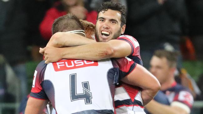 MELBOURNE, AUSTRALIA - APRIL 15:  Nic Stirzaker , Steven Cummins and Jack Debreczeni of the Rebels celebrate at the full time whistle as they win the round eight Super Rugby match between the Rebels and the Brumbies at AAMI Park on April 15, 2017 in Melbourne, Australia.  (Photo by Scott Barbour/Getty Images)