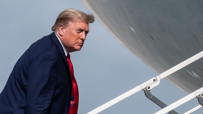 US President Donald Trump boards Airforce One on December 31 as he travels back to Washington, DC after his Christmas holiday break in Mar-a-Lago. Picture: Andrew Caballero-Reynolds/AF)