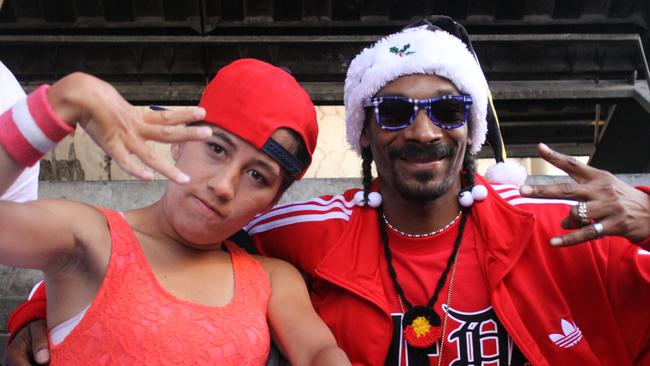 Marlene Katene hangs tough with rapper Snoop Dogg, one of countless celebrities she has met through her music journalism career.