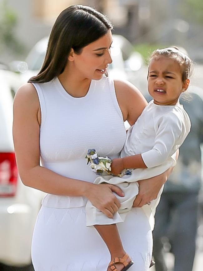 Cute ... Kim and North head to church. Picture: Splash