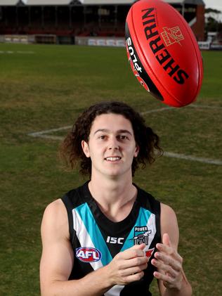 Port Adelaide’s Darcy Byrne-Jones and Adelaide Crows’ Jake Kelly have ...