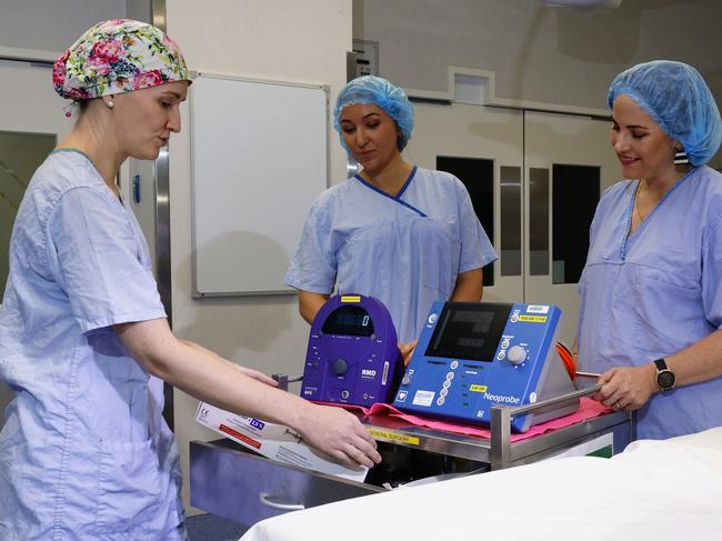 Cairns Hospital's surgical department has received a brand new Neoprobe gamma probes to assist in breast cancer and melanoma surgery. The new medical equipment was bought using money fundraised through the BDO Arrow Experience, run by the Far North Queensland Hospital Foundation. Cairns Hospital surgeon Aemelia Melloy shows Far North Queensland Hospital Foundation CEO Gina Hogan and BDO Accountants CEO Stacey Young how the new surgical equipment works. Picture: Brendan Radke