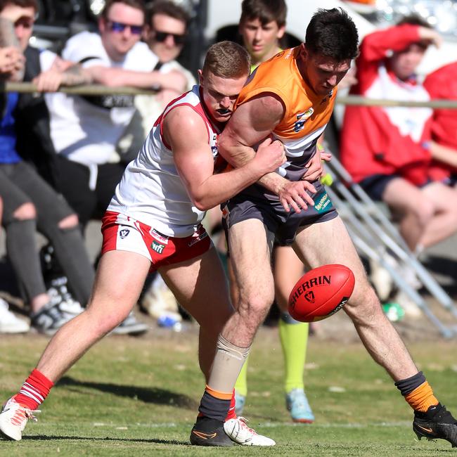 Giants coach Kieran Delahunty is tackled by Ararat’s Robert Armstrong.