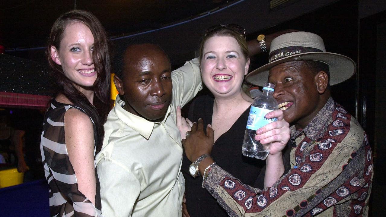 Regan-Jane Thompson, Main Wanjike, Ellie Bell and Eddy Ole Koiyaki at the Rolling Rock Nightclub in Noosa in Febuary 2002. Picture: Lyndon Mechielsen.