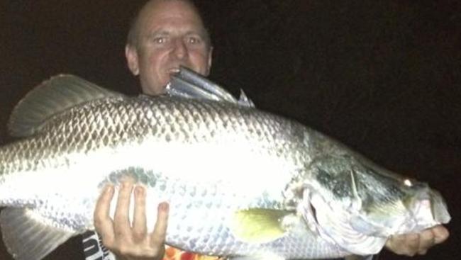 Tim Way with his hefty barra, caught at the mouth of Rapid Creek.