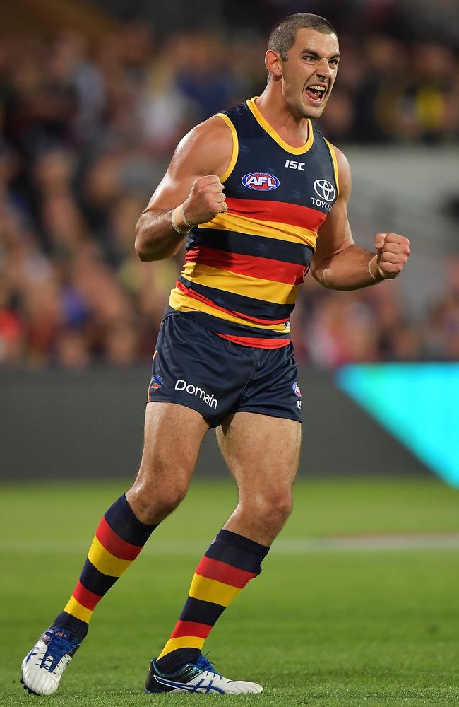 Taylor Walker of the Crows celebrates after kicking a goal.