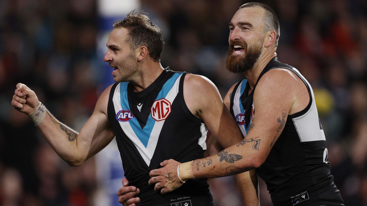 MELBOURNE , AUSTRALIA. April 5, 2024. AFL Gather Round. Round 4. Port Adelaide vs Essendon at the Adelaide Oval. Jeremy Finlayson of the Power celebrates a 4th quarter goal with Charlie Dixon . Pic: Michael Klein