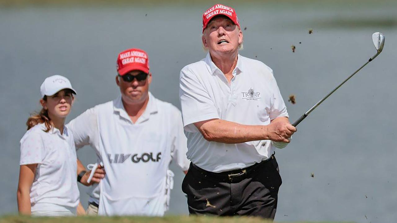 Former President Donald Trump hits out of the bunker during the LIV Golf Miami Team Championship Pro-Am Tournament at Trump National Doral Golf Club in Doral on Thursday, October 27, 2022. (Al Diaz/The Miami Herald/Tribune News Service via Getty Images)