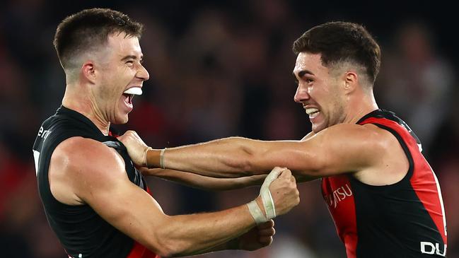 Essendon captain Zach Merrett (left) celebrates the Bombers’ surprise four-point win over St Kilda with teammate Jade Gresham. Picture: Quinn Rooney / Getty Images