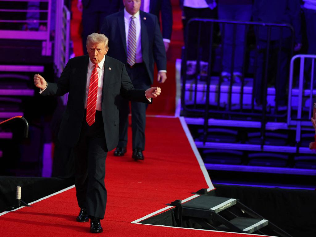 President-Elect Donald Trump walks on the stage at his victory rally at the Capital One Arena. Picture: Getty Images via AFP