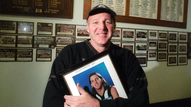 Brian Houlihan with a picture of his son Damian.