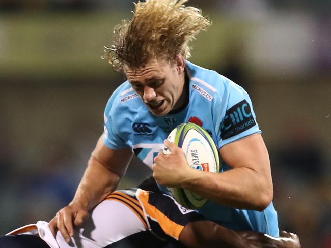 CANBERRA, AUSTRALIA - MARCH 15: Ned Hanigan of the Waratahs Is tackled during the round five Super Rugby match between the Brumbies and the Waratahs at GIO Stadium on March 15, 2019 in Canberra, Australia. (Photo by Mark Metcalfe/Getty Images)